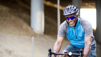 LP-Hero-Desktop-west-cv-vascular-senior-black-man-riding-bike
