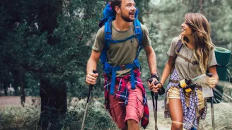 Young couple hiking in woods