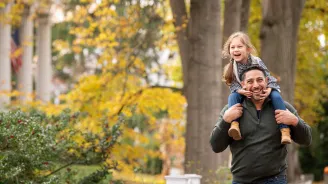 Father and Daughter walking outdoors