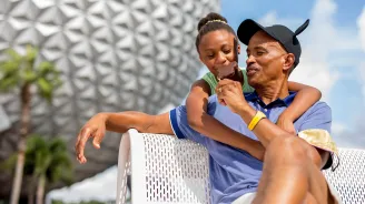Father and Daughter at Epcot eating Ice Cream