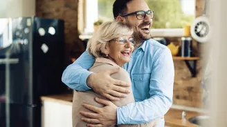 Mother and adult Son hugging