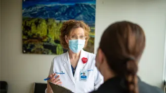 Physician talking with a patient.