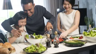 A family makes a meal together