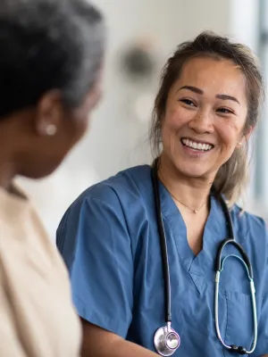 A woman talks with her doctor about her test results.