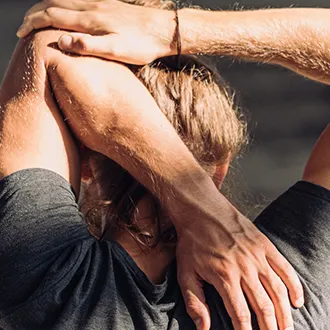 man stretching arm