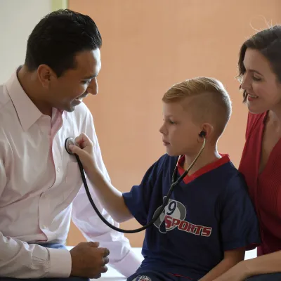 Craniofacial surgeon with patient