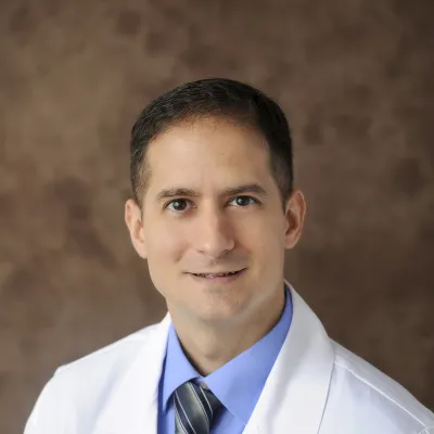 Professional headshot of Enrique Vega