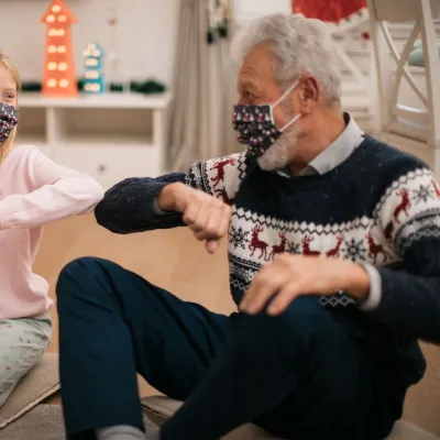 Grandpa giving presents to granddaughter