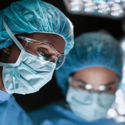 two surgeons performing an operation.