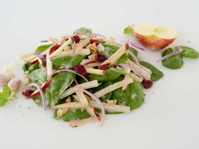 Mound of jicama-apple salad with half apple garnish