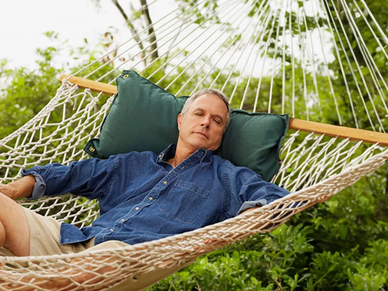 man-resting-in-a-hammock