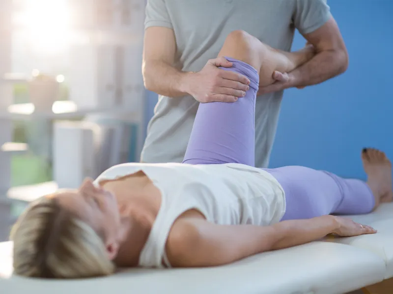 Physical Therapist Performing Stretch