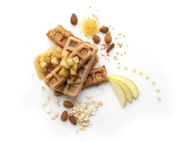 Waffle strips with apple and almond garnishes