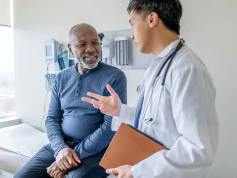 A Doctor Speaks to a Senior Couple About Their Health