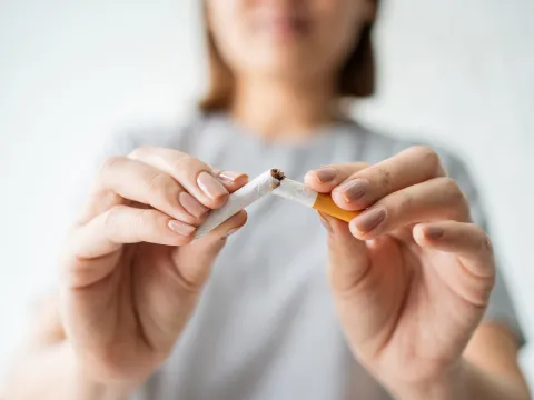 freedom-from-smoking-woman-breaking-cigarette