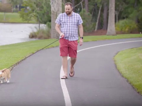 AdventHealth patient Chris Cooper walking his dog
