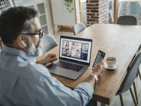 A man teleconferencing from home. 