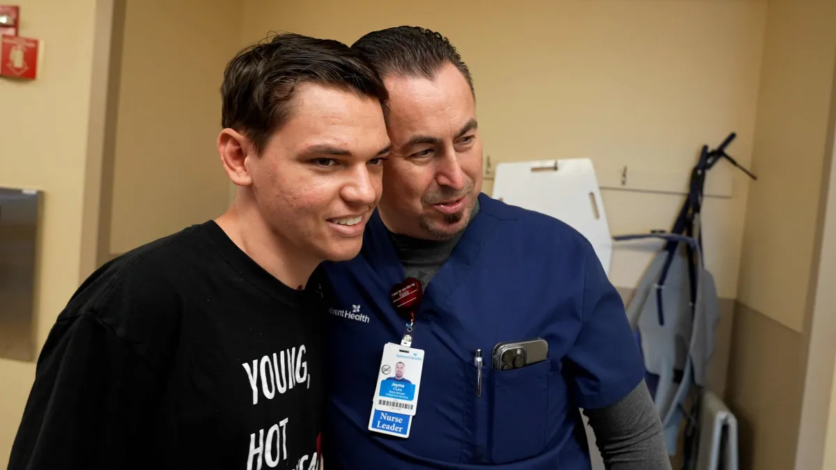 Josiah Stubbs visits Jayme Cluka, AdventHealth Daytona Beach ICU nurse manager.