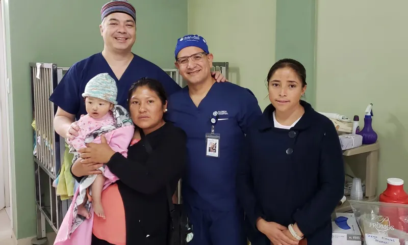 a group photo with a baby